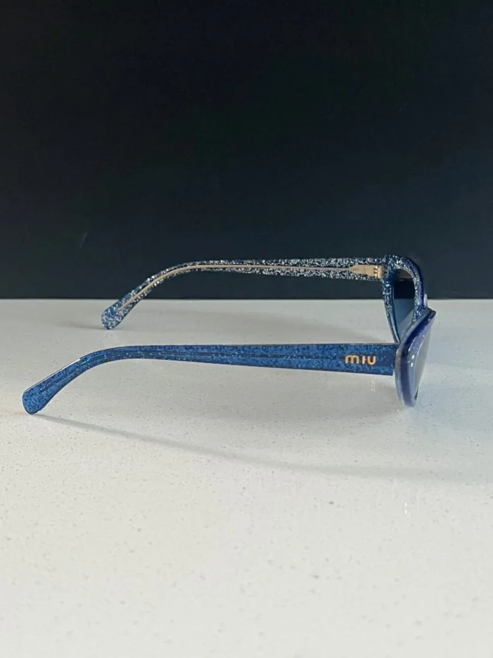 Miu Miu MU 09US 1452B2 blue glitter cat-eye sunglasses